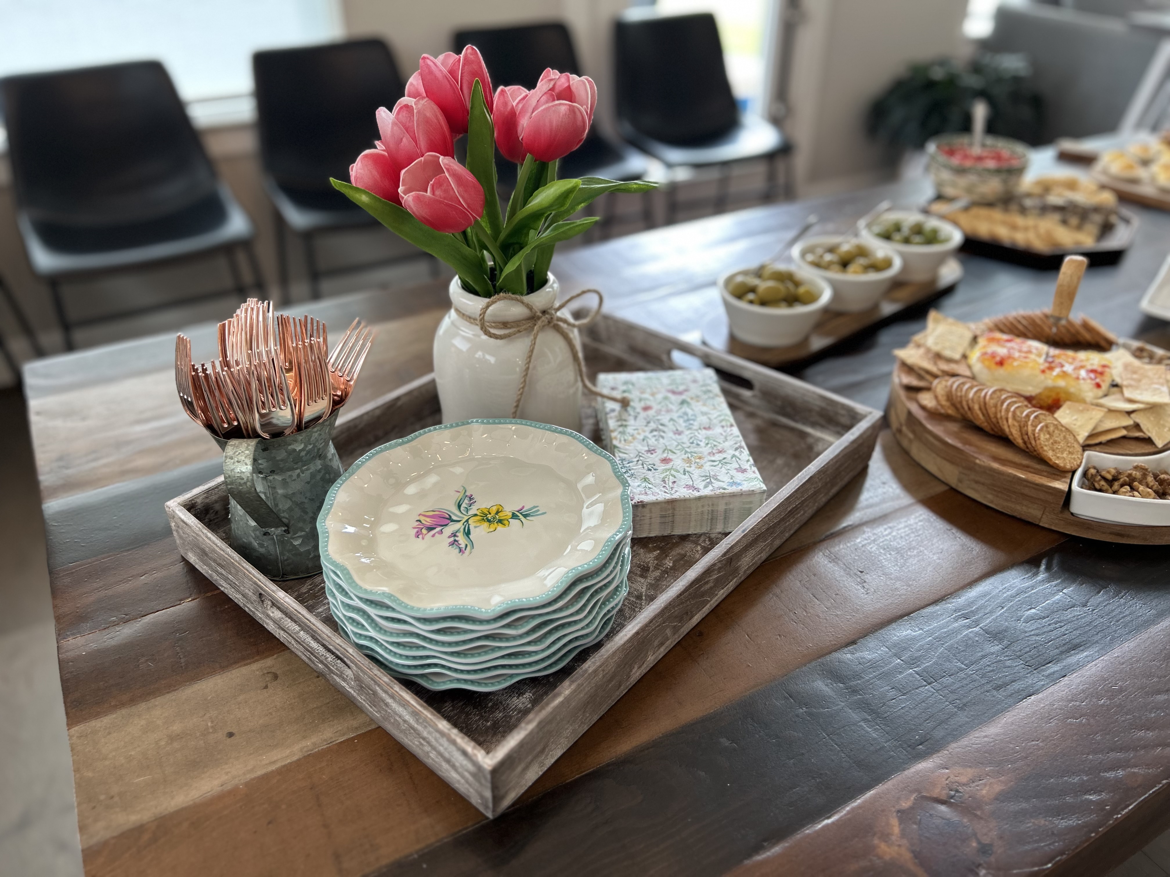 Styled table with teal plates and tulips
