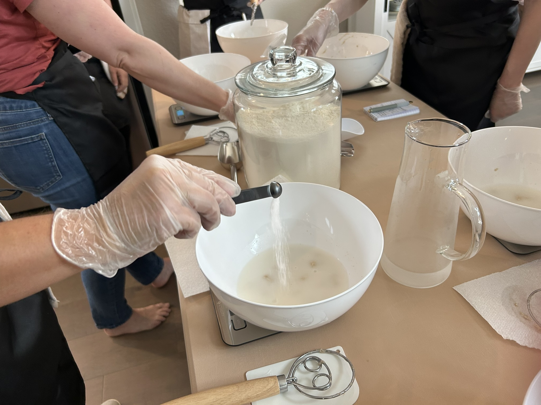 Hands mixing sourdough