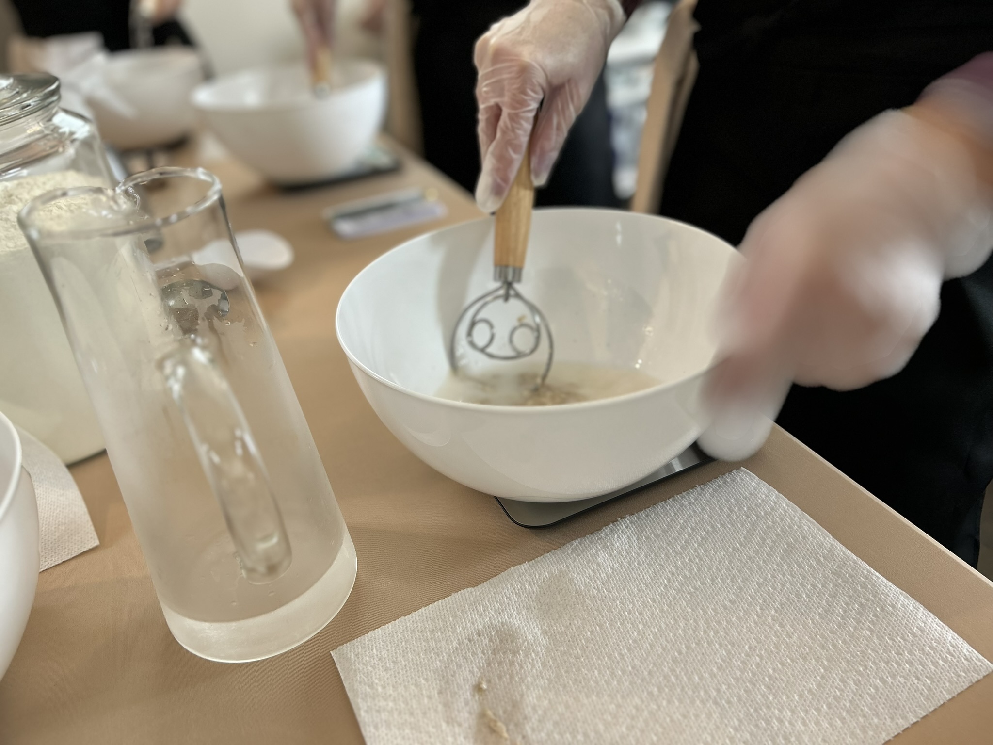 Close-up of dough whisk in bowl