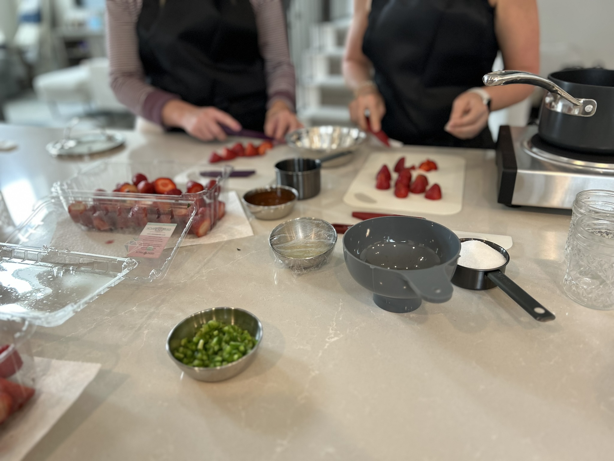 Guests prepping strawberries side by side