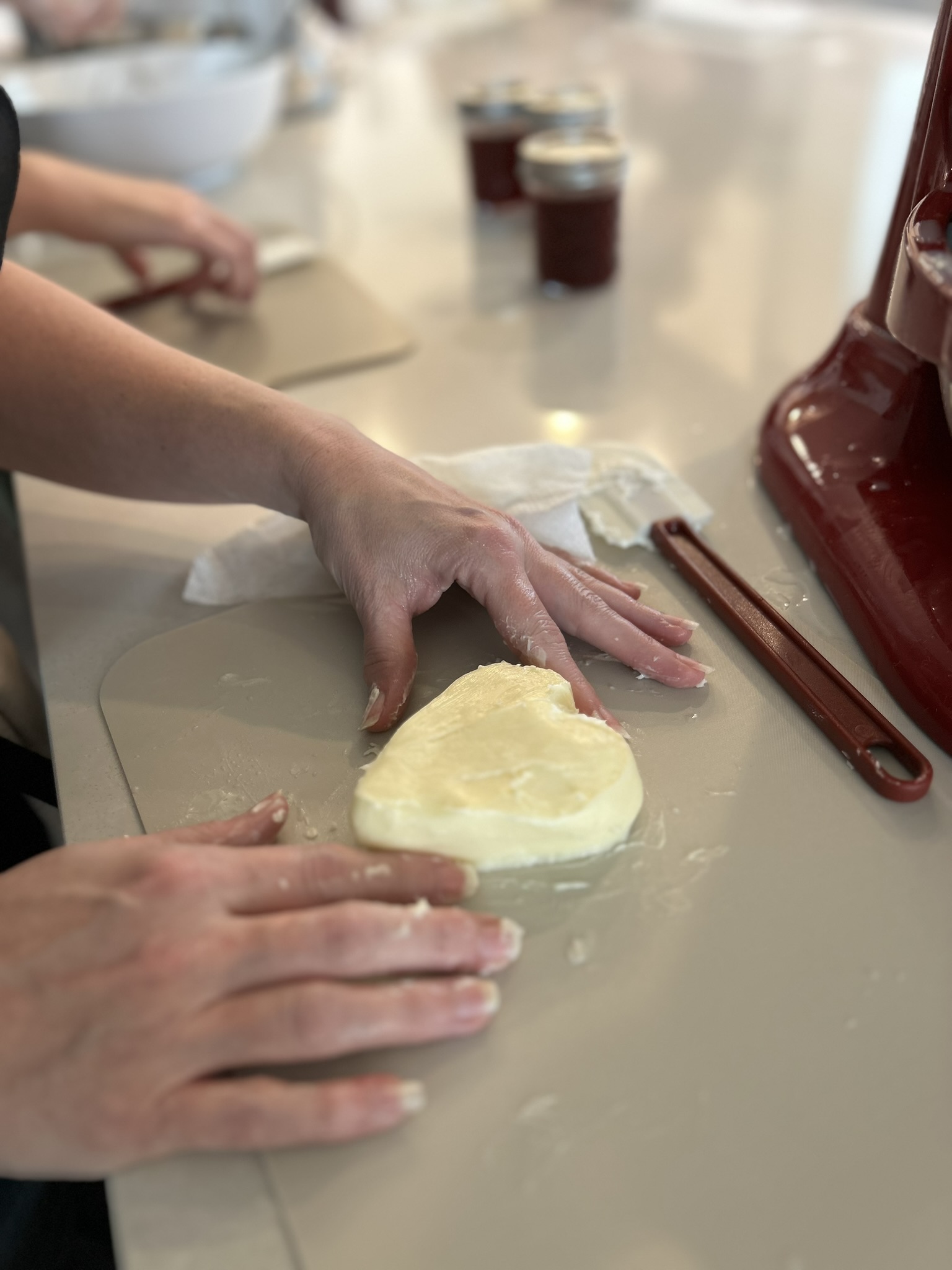 Hands working butter