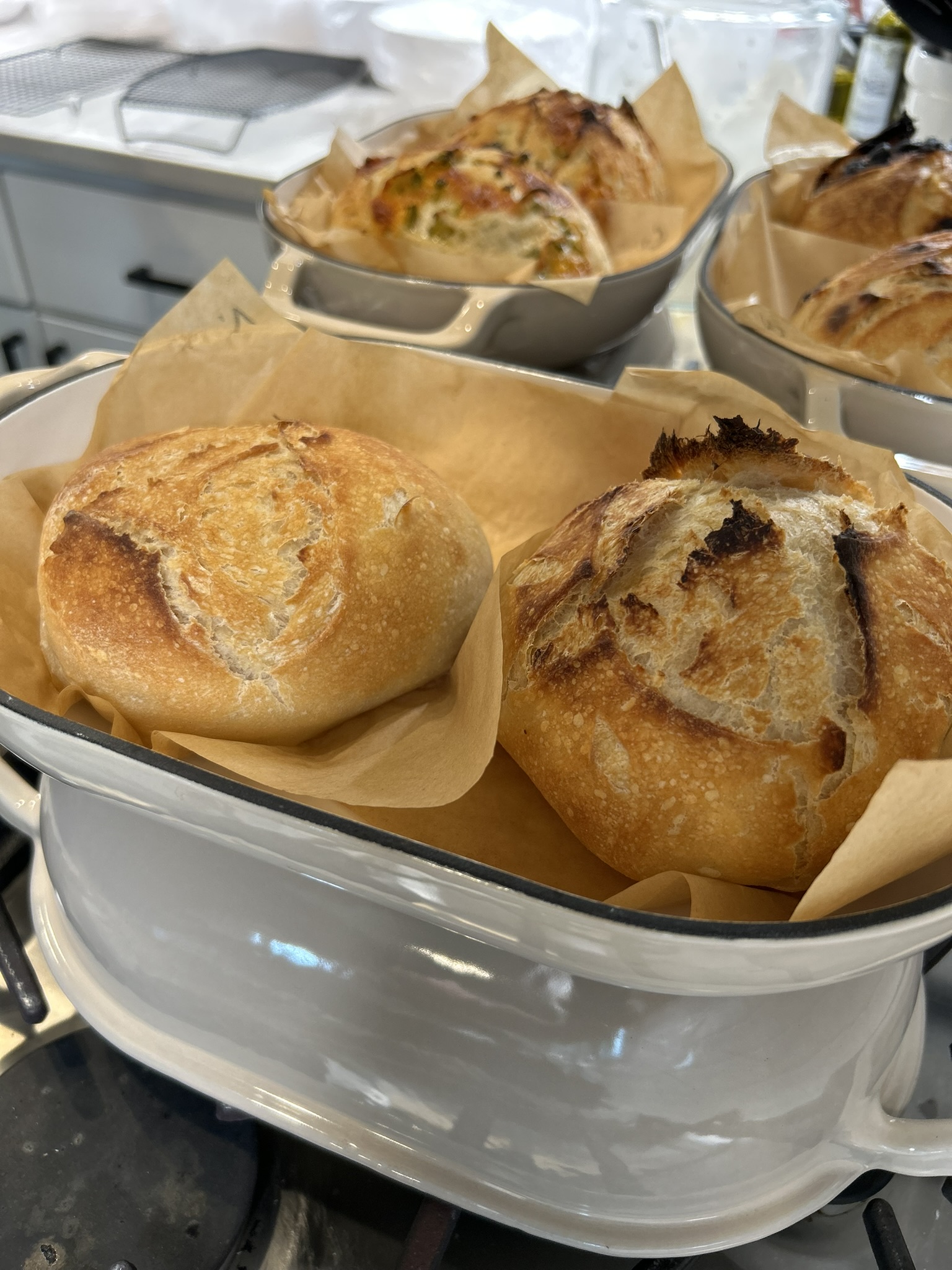 Baked loaves in Dutch ovens on the stovetop