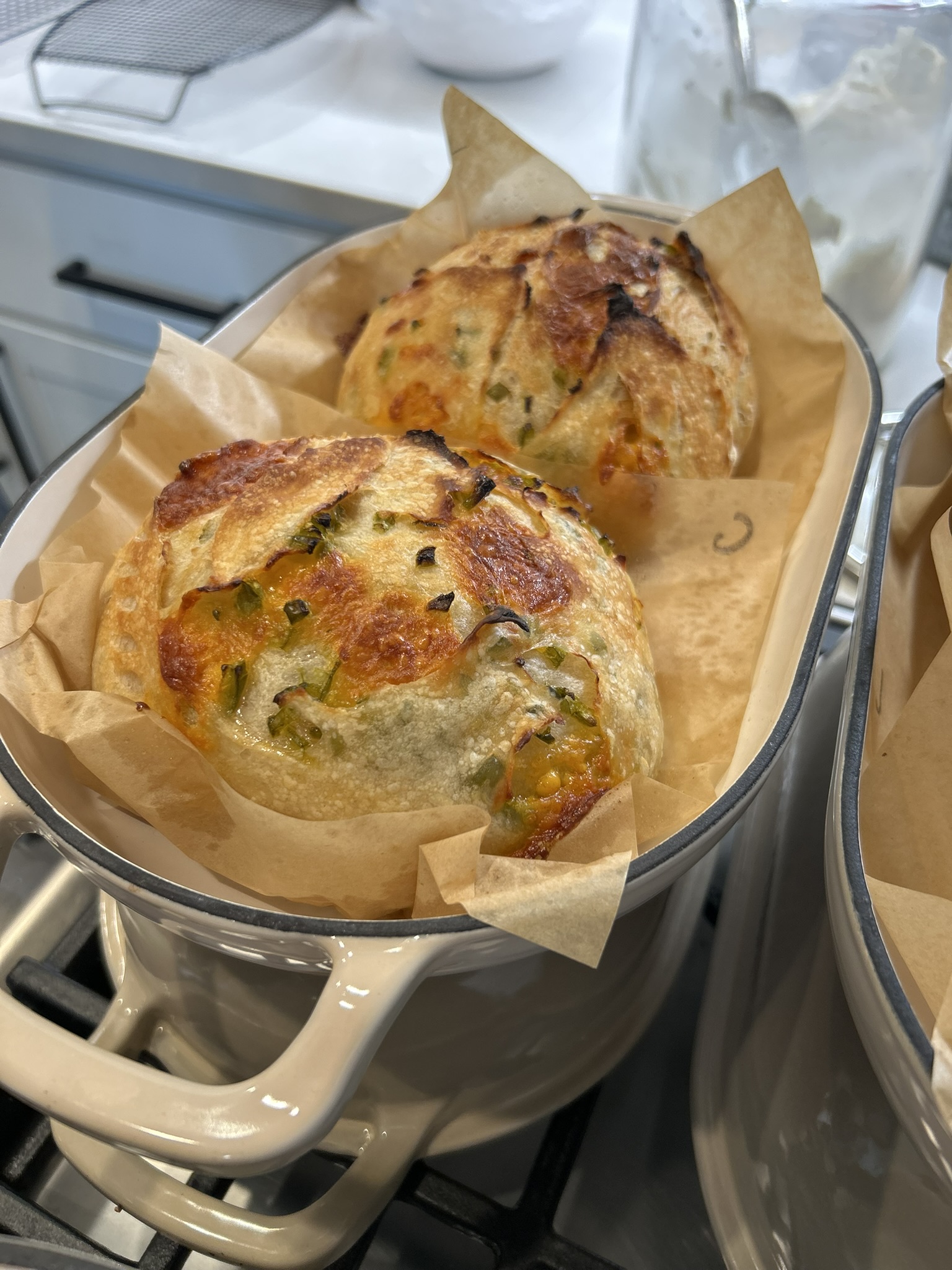 A perfect baked sourdough loaf in parchment paper