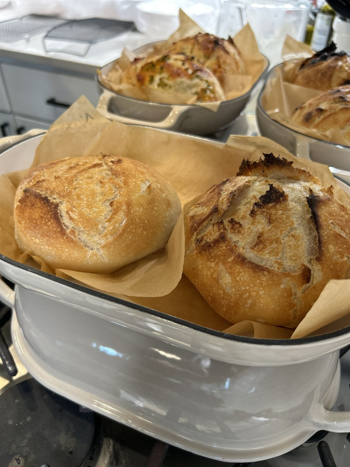 Baked loaves in Dutch ovens on the stovetop