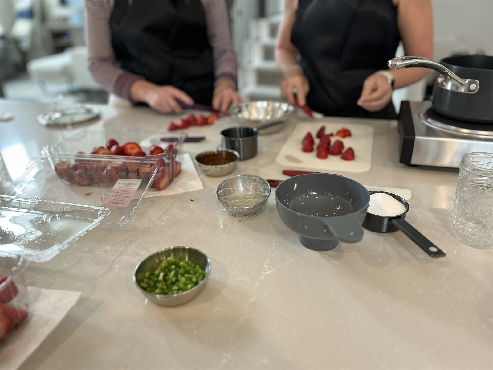 Guests prepping strawberries side by side
